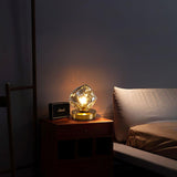 Skleněná stolní lampa ve tvaru ledového kamene