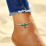 Ankle bracelet with stars, shells, and natural stones