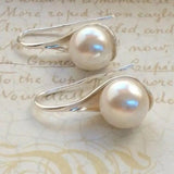Elegant earrings with teardrop pearls
