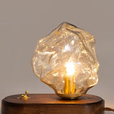 Skleněná stolní lampa ve tvaru ledového kamene