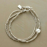 Conjunto de pulseras vintage con perlas
