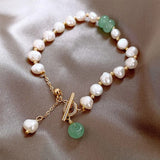 Vintage bracelet with pearls and golden green gemstones